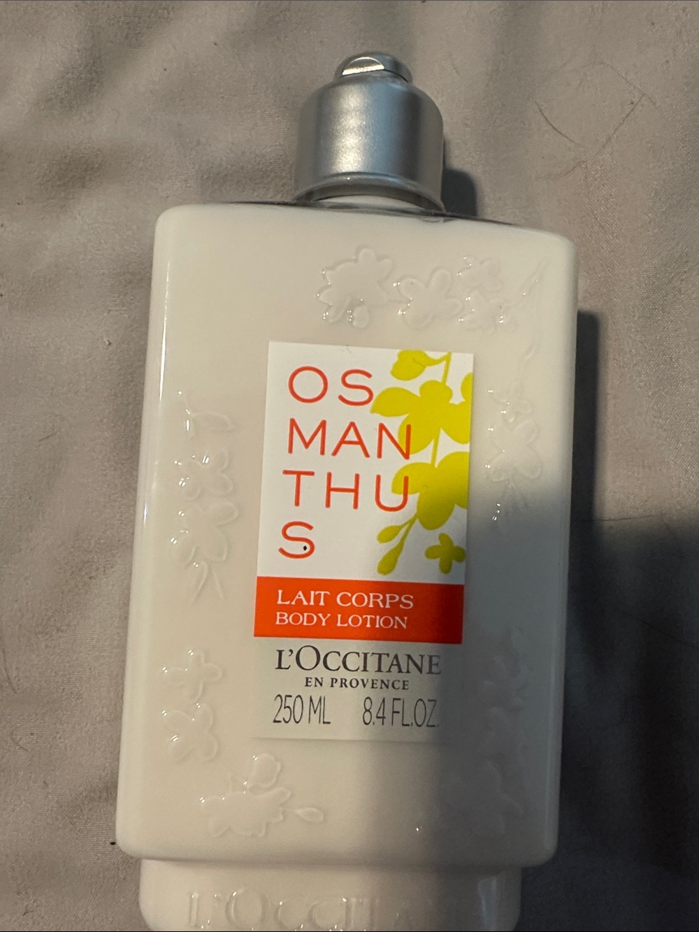 L'OCCITANE Osmanthus Body Lotion — White with Yellow Accents